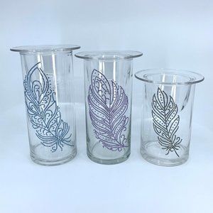 Set of three candle holders or vases with removable candle holder.